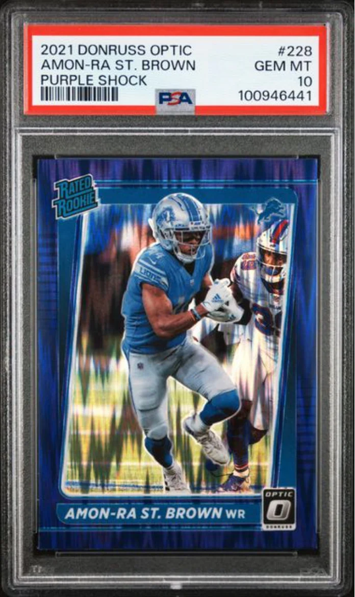 Graded 2021 Panini Donruss Optic Amon-Ra St. Brown #228 Purple Shock Rookie RC Football Card PSA 10 Gem Mint